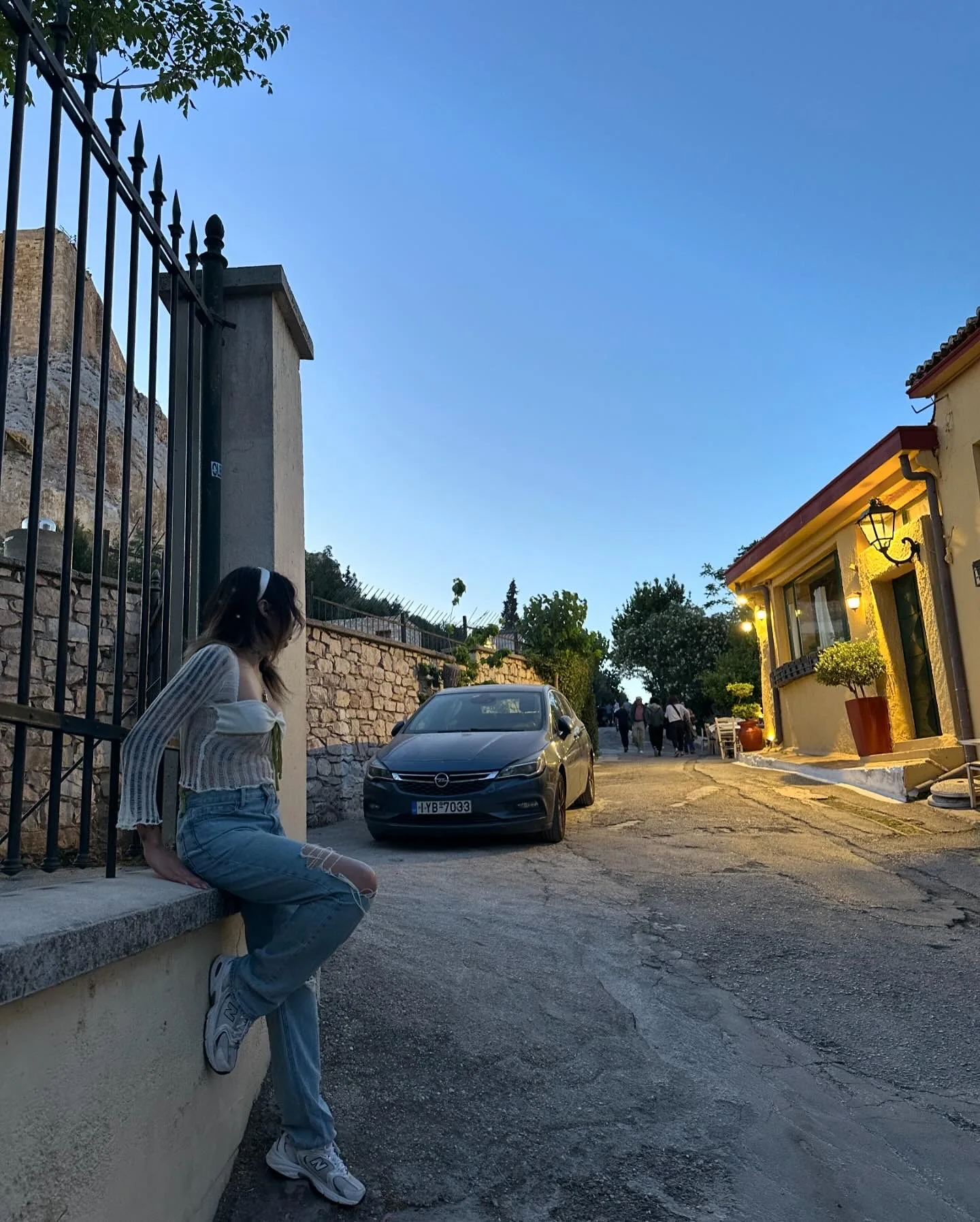 Traveler overlooking a European city while working from the road